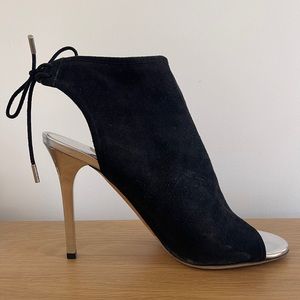 Jimmy Choo open toe bootie pumps with silver stiletto heel.